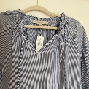Loft, white and blue striped blouse made of 100% rayon.